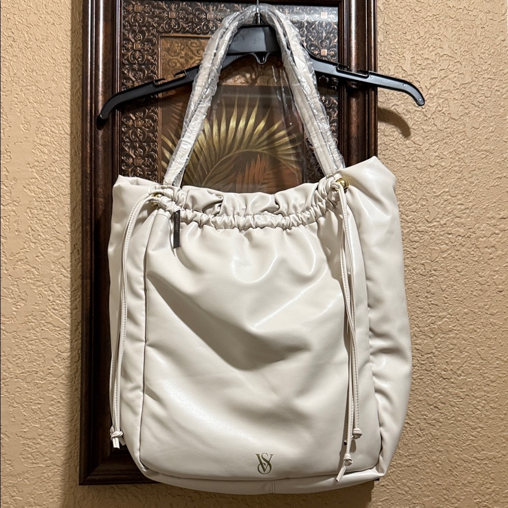NWT Victoria's Secret Cream Shoulder Bag. Cinch drawstring closure.